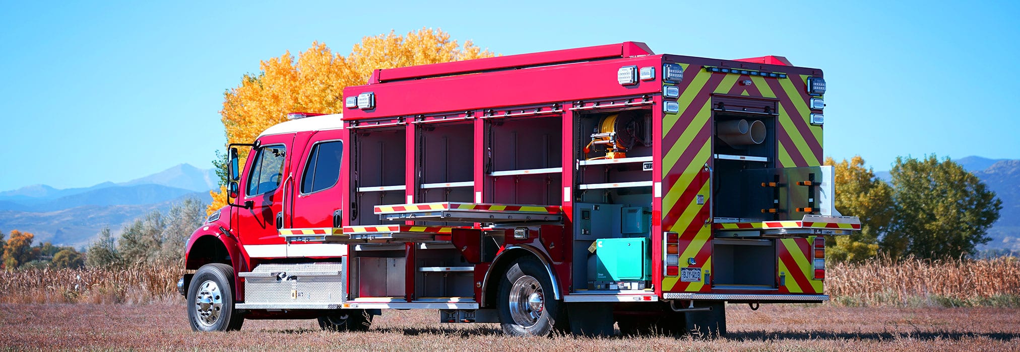 rear street side view of Orange County medium hazmat truck with open doors