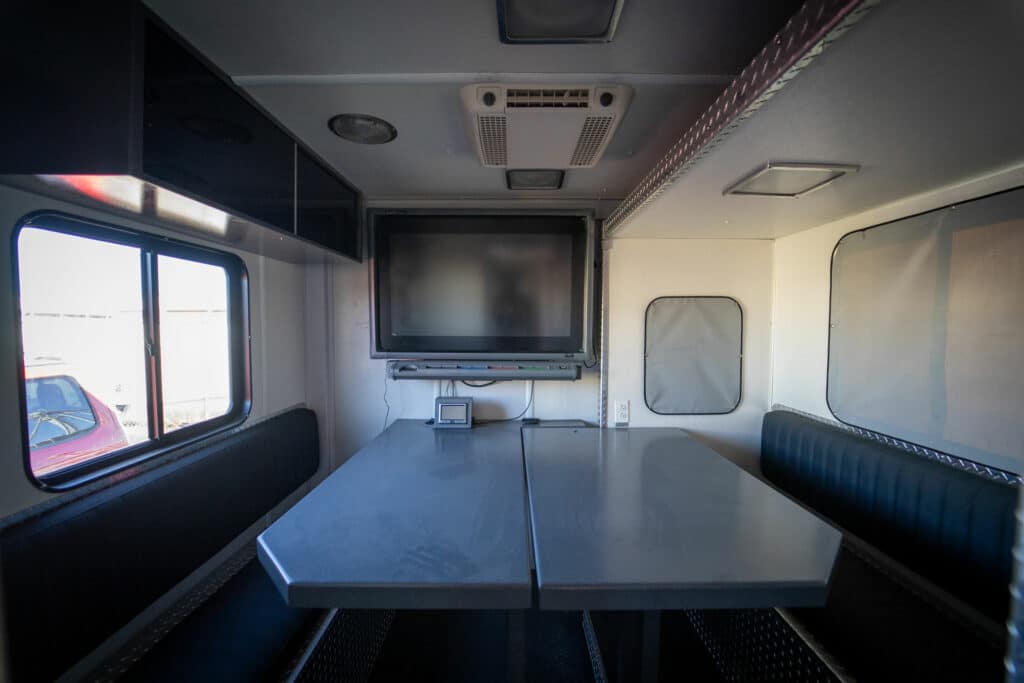 hazmat command center interior room with table and smartboard