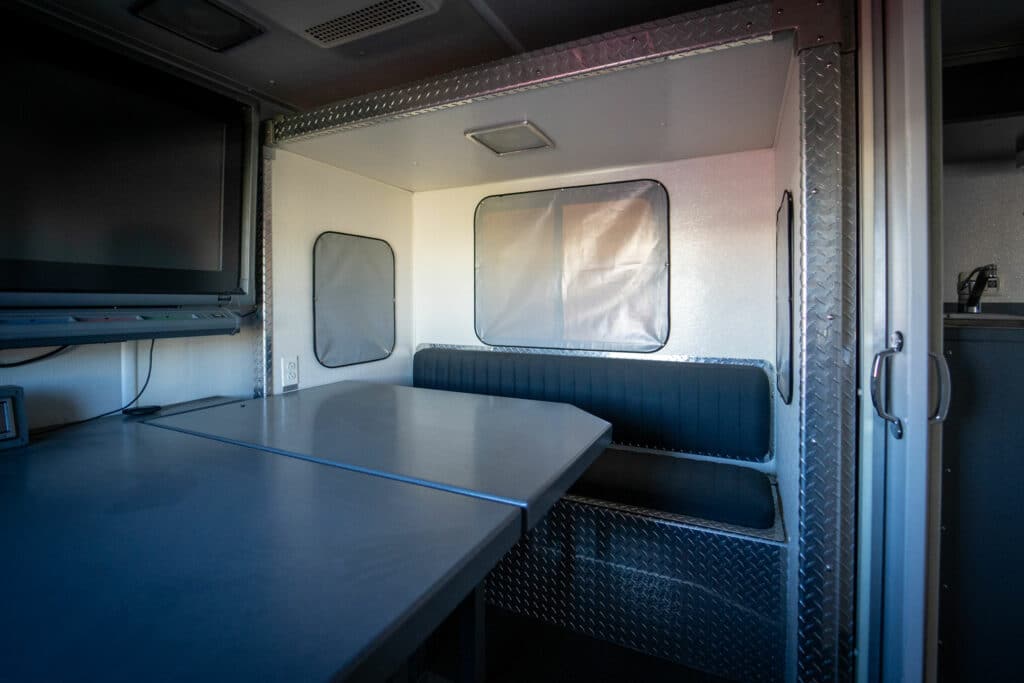 hazmat command center interior with table and smartboard