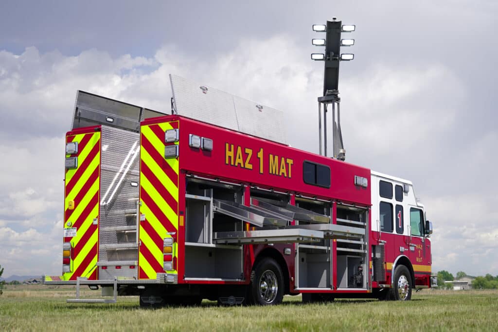rear curbside open view of Brevard County Fire Rescue walk-in hazmat mobile command center with Command Light extended