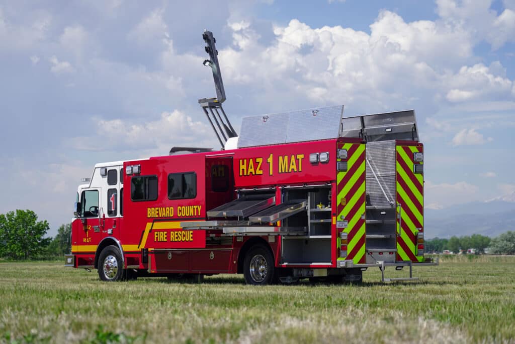 rear street side view of Brevard County Fire Rescue walk-in hazmat mobile command center with Command Light extended